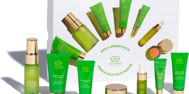 Tata Harper Daily Essentials Set with seven clean beauty products for radiant skin, arranged on a marble surface with eco-friendly packaging and natural accents.