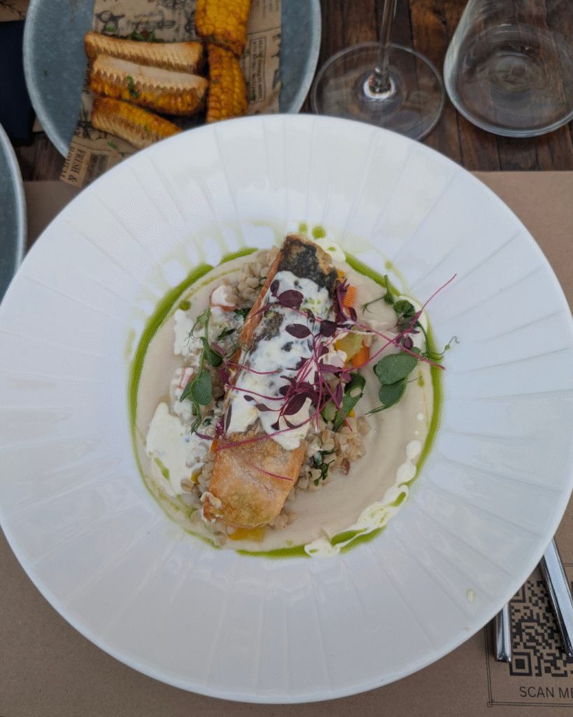 Pan-seared salmon with seasonal vegetables and celeriac purée at Mate’s Restaurant.