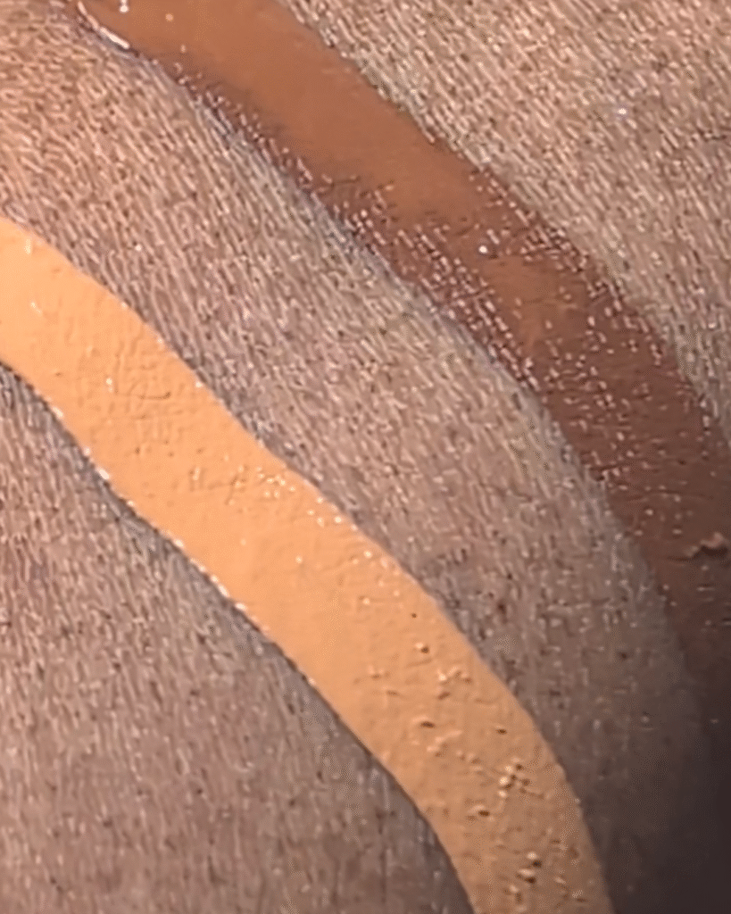 SUQQU Creamy Cover Concealer applied under eye showing luminous coverage
