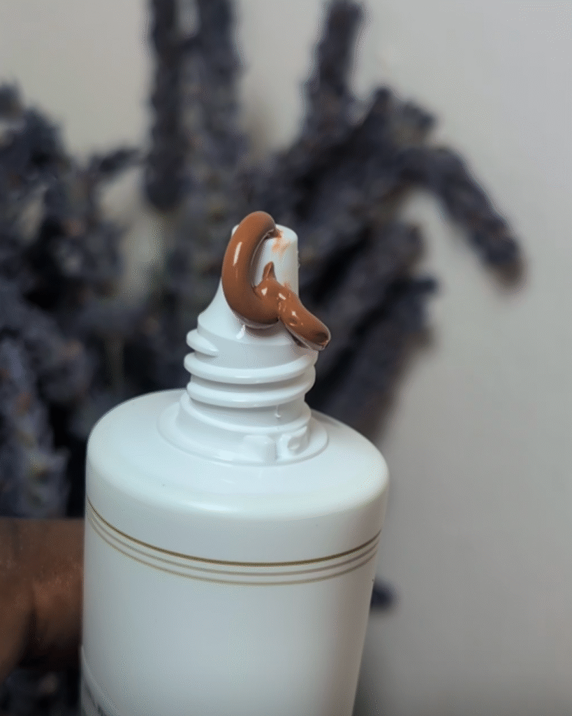 Close-up texture shot of SUQQU Skincare Cream Tint creamy formula
